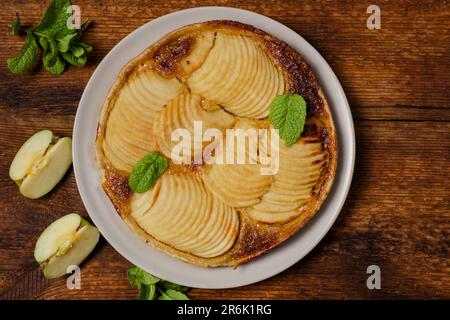 French apple pie on wooden background. Top vii. Stock Photo