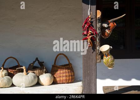 Baskets and pumpkins by a country house Stock Photo