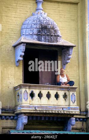 An old muslim man sitting in the balcony, Siddique Sarai Choultry, its Moorish architecture revealing where Indo Saracenic had its roots. Chennai Stock Photo