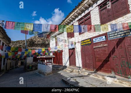 Historical village of Marpha and prayer flags, Jomsom, Himalayas, Nepal, Asia Stock Photo