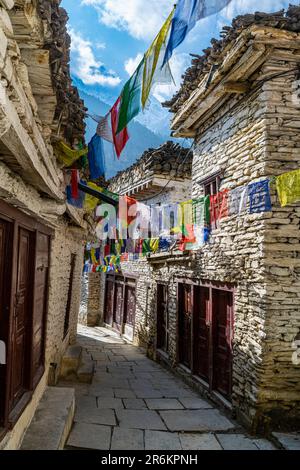 Historical village of Marpha and prayer flags, Jomsom, Himalayas, Nepal, Asia Stock Photo