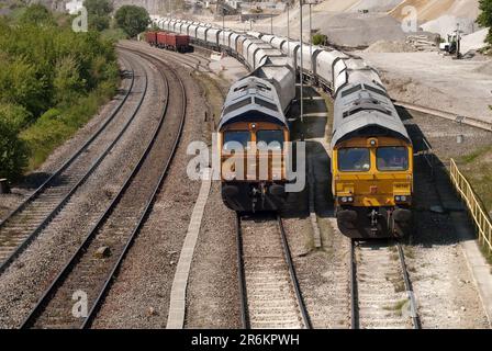 GBRF Class 66 locomotives wait for trains to be loaded with fine-grain aggregates at the Cemex quarry in Derbyshire Stock Photo