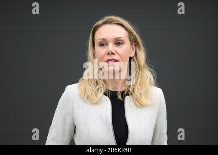 Middle age woman looks thoughtful to side Stock Photo