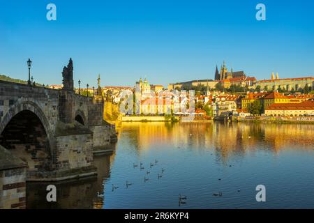 Prague Castle and Charles Bridge on Vltava River in city at sunrise, UNESCO World Heritage Site, Prague, Bohemia, Czech Republic (Czechia), Europe Stock Photo