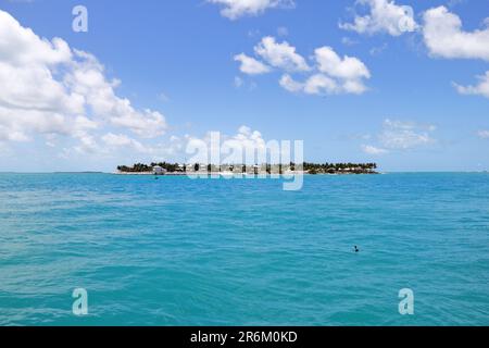 This image features a stunning view of the ocean, with a row of colorful houses seen in the background Stock Photo