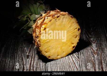 sliced pineapple on wood background Stock Photo
