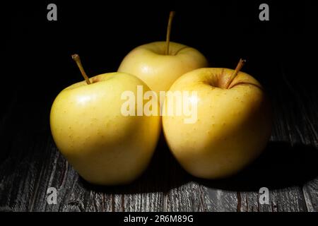 yellow apples on wood background Stock Photo