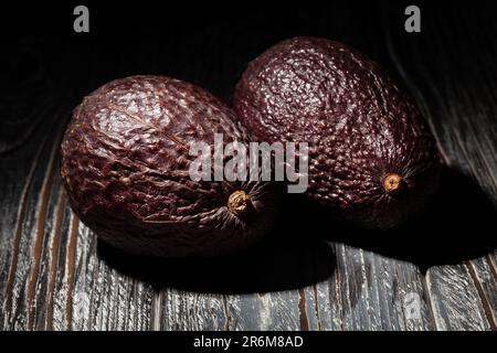 hass avocado on wood background Stock Photo