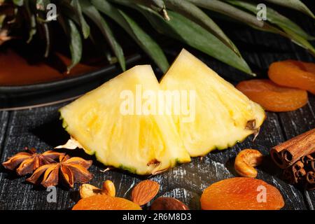 sliced pineapple on wood background Stock Photo