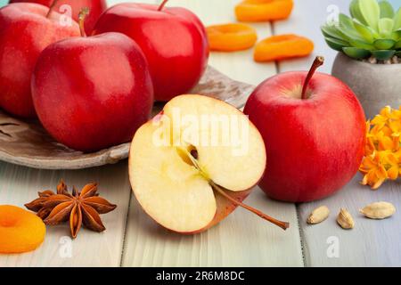 sliced red apples on wood background Stock Photo