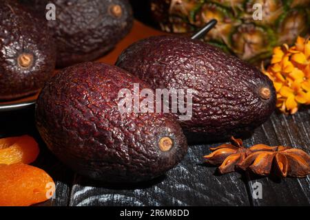 hass avocado on wood background Stock Photo
