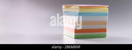 Stack of multicolored sticky notes on gray background Stock Photo