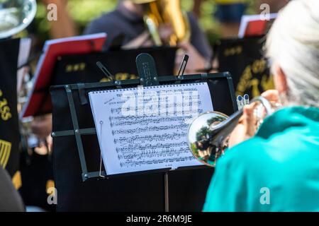 Forest of Dean sheet music. Forest of Dean Brass band performs the piece by Evan A Jones at Beechenhurst, Gloucestershire. UK Stock Photo