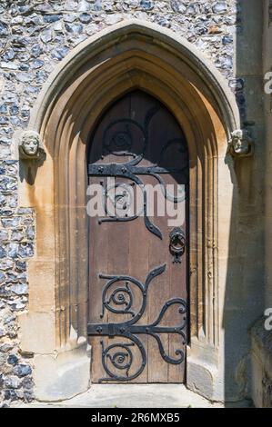 Small ornate wooden door on south side of St Mary's Church. Chesham, Buckinghamshire, England, UK Stock Photo