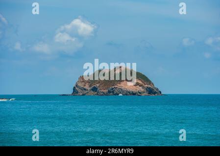 Cliff in the middle beautiful seascape under blue sky at Costa Rica Stock Photo