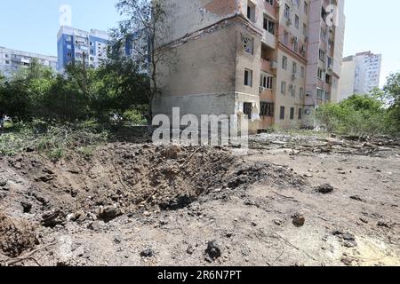 ODESSA, UKRAINE - June 10, 2023: War Ukraine and Russia. A shell flew into courtyard of building. Damaged facade, broken windows of house as result of Stock Photo