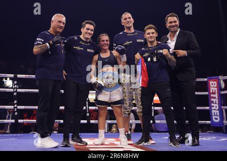 Ellie Scotney posing with her belt and coaching team following the IBF Super-Bantamweight World Title match at the OVO Arena Wembley, London. Picture date: Saturday June 10, 2023. Stock Photo