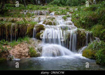 Waterfalls of the source of the Cuervo River in the Serrania de Cuenca natural park in Cuenca, Spain Stock Photo