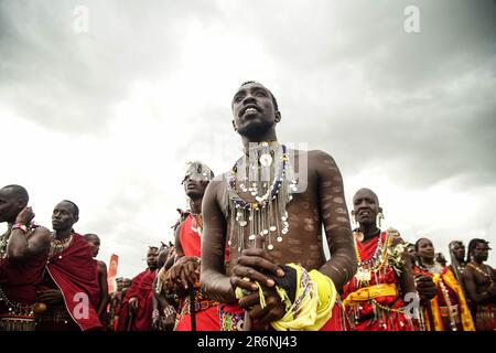 Narok, Kenya. 10th June, 2023. Maasai men wearing their traditional attires follow proceedings during The Maasai Cultural Festival in Narok, near The Maasai Mara National Reserve. In their inaugural cultural festival, The Maasai sang, danced and showcased their dressing as well as their rituals. Credit: SOPA Images Limited/Alamy Live News Stock Photo