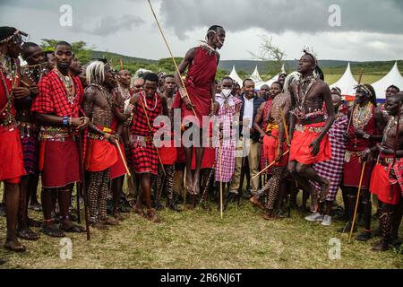 Narok, Kenya. 10th June, 2023. Maasai men wearing their traditional attires jump while singing during The Maasai Cultural Festival in Narok, near The Maasai Mara National Reserve. In their inaugural cultural festival, The Maasai sang, danced and showcased their dressing as well as their rituals. Credit: SOPA Images Limited/Alamy Live News Stock Photo