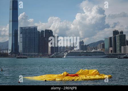 Hong Kong. 10th June 2023. A deflated enormous inflatable duck seen at Victoria Harbour. Starting from June 10th, 2023, the highly anticipated art exhibition named 'Double Ducks,' created by Dutch artist Florentijn Hofman, officially opens to the public at Victoria Harbour in Hong Kong. Credit: SOPA Images Limited/Alamy Live News Stock Photo