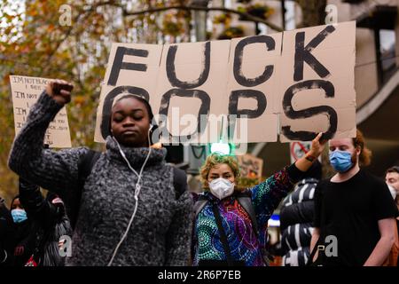 MELBOURNE, AUSTRALIA - JUNE 06: Protesters are seen holding anti police placards during a Black Lives Mater rally on 06 June, 2020 in Melbourne, Australia. This event was organised to rally against aboriginal deaths in custody in Australia as well as in unity with protests across the United States following the killing of an unarmed black man George Floyd at the hands of a police officer in Minneapolis, Minnesota. Stock Photo