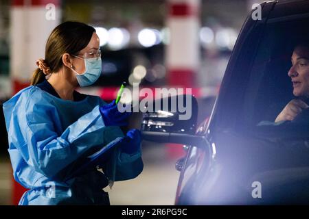 MELBOURNE, AUSTRALIA - APRIL 30: A nurse wearing full PPE takes swabs in the Pacific Epping Shopping Centre where one of the new mobile testing sites is located during COVID 19 on 30 April, 2020 in Melbourne, Australia. Stock Photo