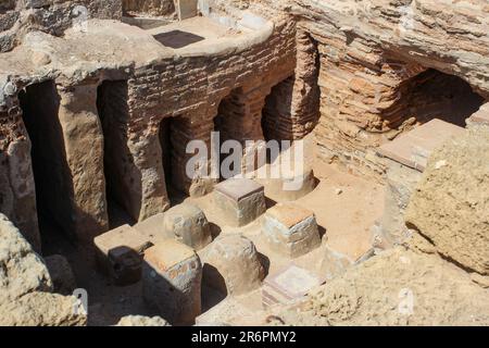 The ruins of an ancient Roman bathhouse complex in Caesarea National Park reveals the hypocaust central heating system. Stock Photo