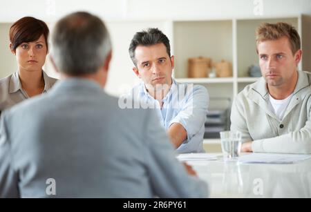 Serious, meeting and business people in discussion in the office for human resources problem. Collaboration, team and group of professional employees Stock Photo