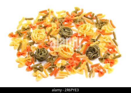 A different pasta in three colors on the white background. Stock Photo