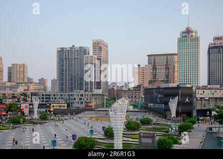 NINGBO, CHINA - JUNE 10, 2023 - People admire a 'LOWER BACK girl' air model at a square in Ningbo, Zhejiang province, China, June 10, 2023. Stock Photo