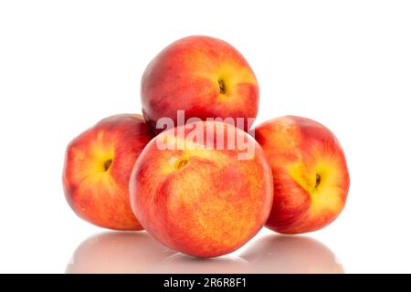 Several sweet nectarines, macro, isolated on white background. Stock Photo