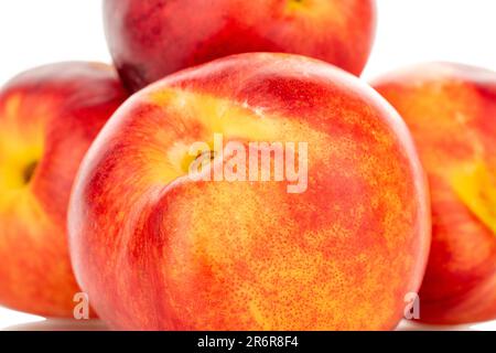 Several sweet nectarines, macro, isolated on white background. Stock Photo