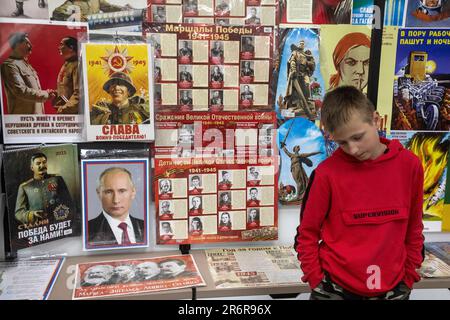 Moscow, Russia. 10th of June, 2023. A boy looks souvenirs in a shop of the Victory Museum in Moscow, Russia Stock Photo