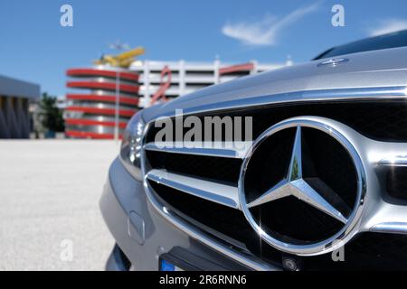 Chrome logo on Mercedes E class Stock Photo