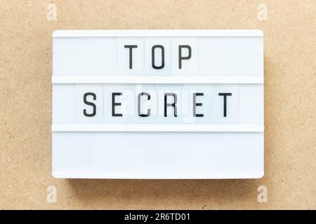 Lightbox with word top secret on wood background Stock Photo