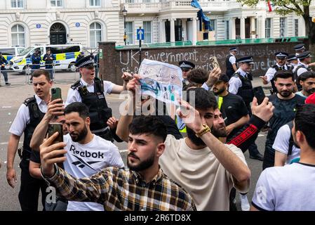 Knightsbridge, London, UK. 11th Jun, 2023. Protesters gathered outside the Embassy of the Islamic Republic of Iran in London protesting in support of the Kurdish people, prompting a large police response. Stock Photo