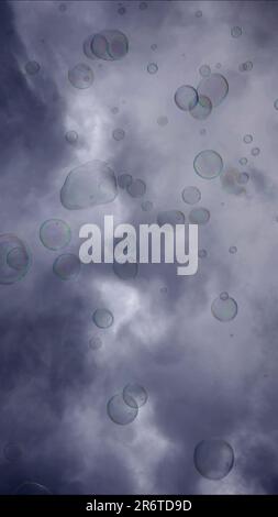 Warsaw, Poland. 11th June, 2023. Soap bubbles are flying on gray cloudy sky background (Credit Image: © Andrey Nekrasov/ZUMA Press Wire) EDITORIAL USAGE ONLY! Not for Commercial USAGE! Stock Photo