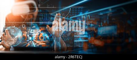 Engineer manager wearing virtual reality headset uses VR technology checking and control automation robot arms machine Welding robotics and digital ma Stock Photo