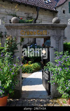 Entrance gate with Gruess Gott inscription Stock Photo