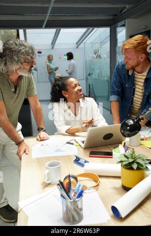 In the Modern Office: Diverse Group of Colleagues Have Meeting, Develop Strategy, Discuss Project Stock Photo