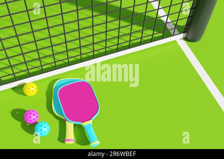 Pickleball. Rackets and balls lie on the court near the sports net. 3D rendering Stock Photo