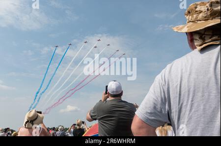 Royal Air Force Cosford, Cosford, Shropshire, England. 11th June 2023. Royal Air Force aerobatic team ‘The Red Arrows’ arrives to display, while the crowd watches on, RAF Cosford Air Show at Royal Air Force Cosford. Credit Image: (Cody Froggatt/Alamy Live News) Stock Photo