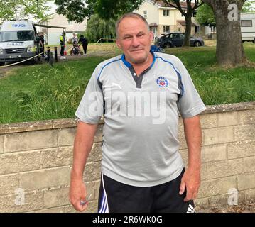 Steven Smart, 65, stands near to the police cordon in Eastfield Avenue, Bath, where a 16-year-old boy was fatally stabbed on Saturday evening. Emergency services were called to an address shortly after 11pm on Saturday following reports of a stabbing, Avon and Somerset Police said. Eight teenagers have been arrested on suspicion of murder following the stabbing. Picture date: Sunday June 11, 2023. Stock Photo