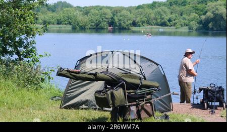 Sale Water Park, Trafford, Greater Manchester, fisherman with tent and equipment, fish, fishing, Stock Photo