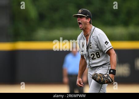 Wake Forest pitcher Cole Roland (28) reacts to striking out Alabama's ...