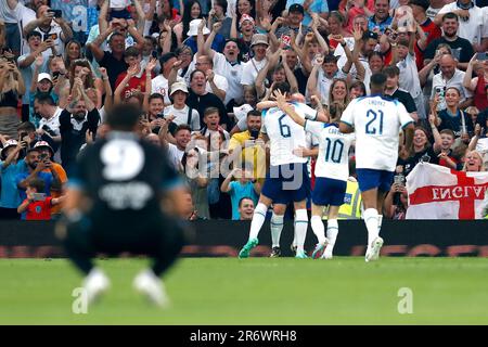 England's Paul Scholes (hidden) celebrates scoring their side's second goal of the game with team-mates during Soccer Aid for UNICEF 2023 at Old Trafford, Manchester. Picture date: Sunday June 11, 2023. Stock Photo