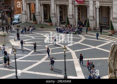 People walking in Piazza del Campidoglio,a public square beautifully designed by Michelangelo at the top of the ancient Capitoline Hill,Rome, Italy Stock Photo