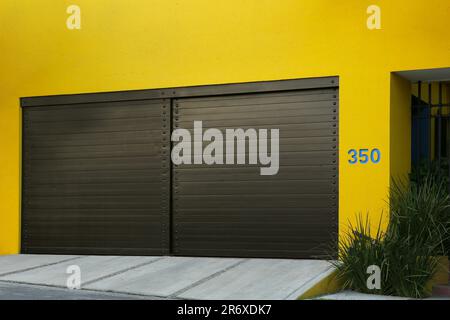 Closed gates of modern garage. Exterior design Stock Photo