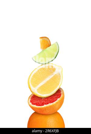 Stack of different fresh citrus fruits on white background Stock Photo